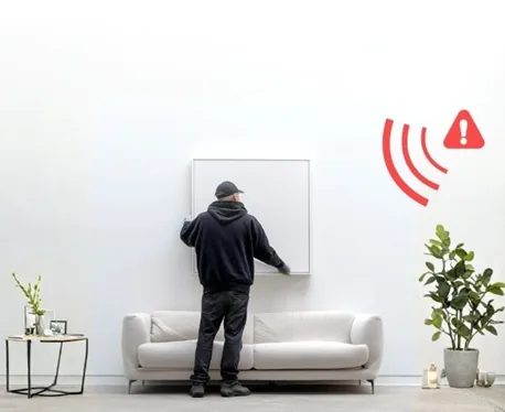 Artwork removal alert protecting a painting in a refined interior